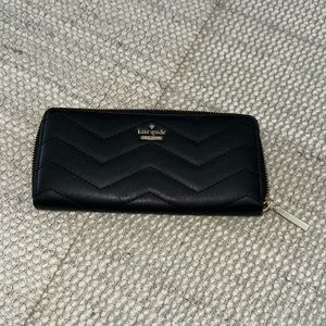 Kate Spade black leather wallet with chevron.